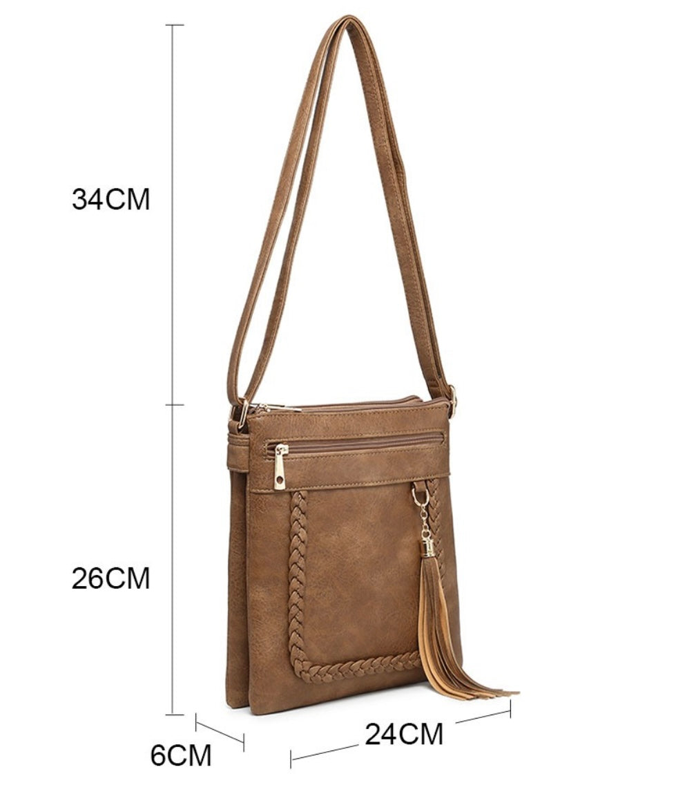 Red crossbody bag with tassel pendant detail