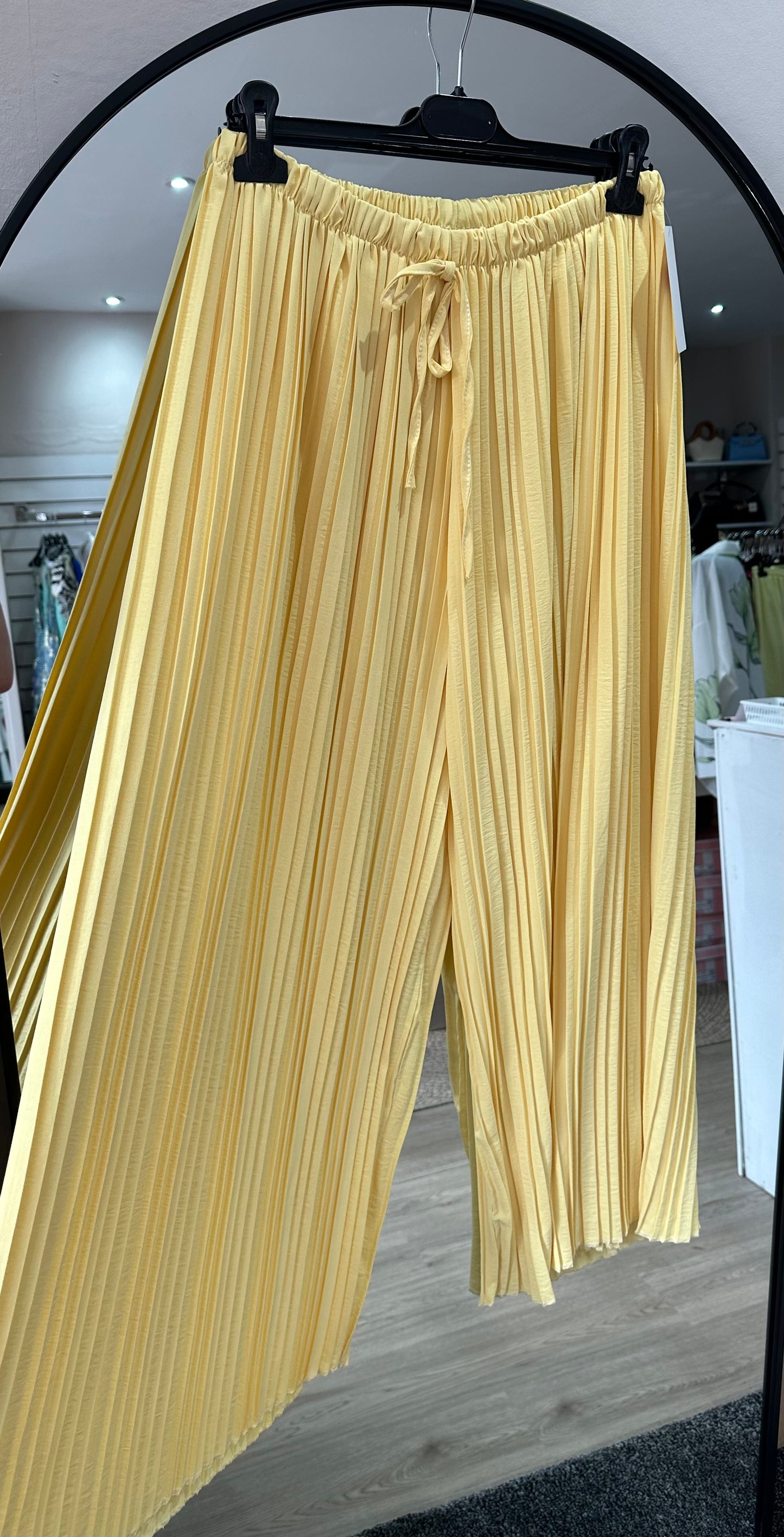Yellow pleated wide leg trousers