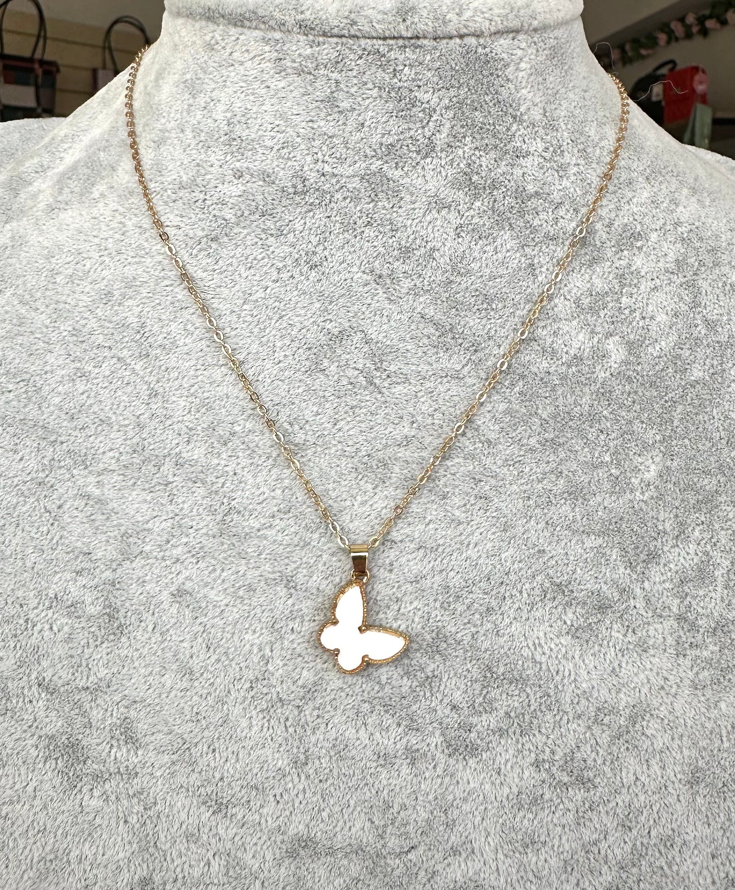 White butterfly detail gold chain necklace