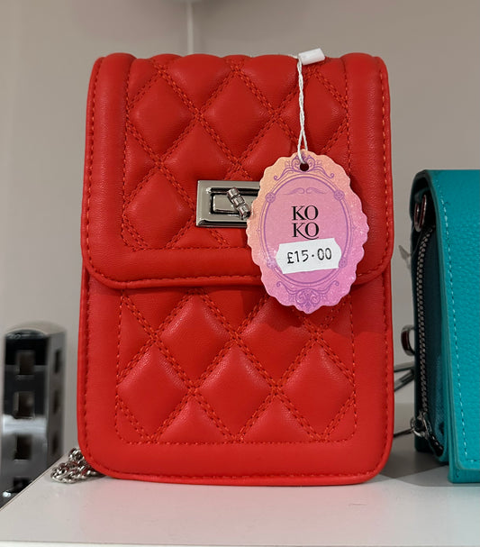 Orange quilted detail crossbody bag with silver chain strap