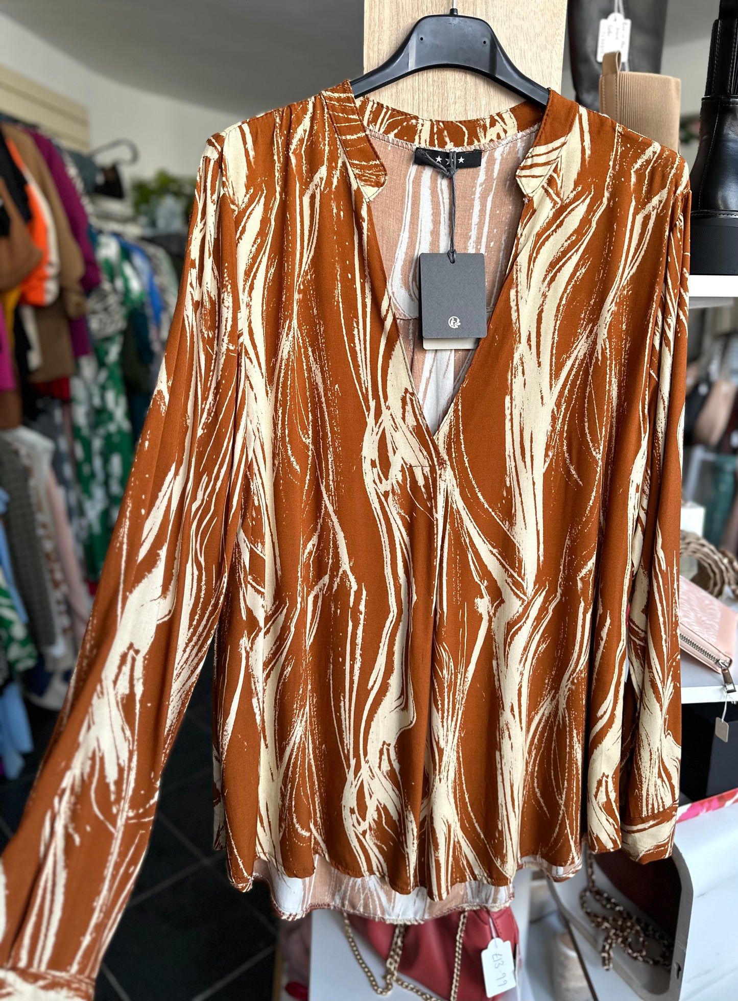 Cinnamon abstract print long sleeve blouse