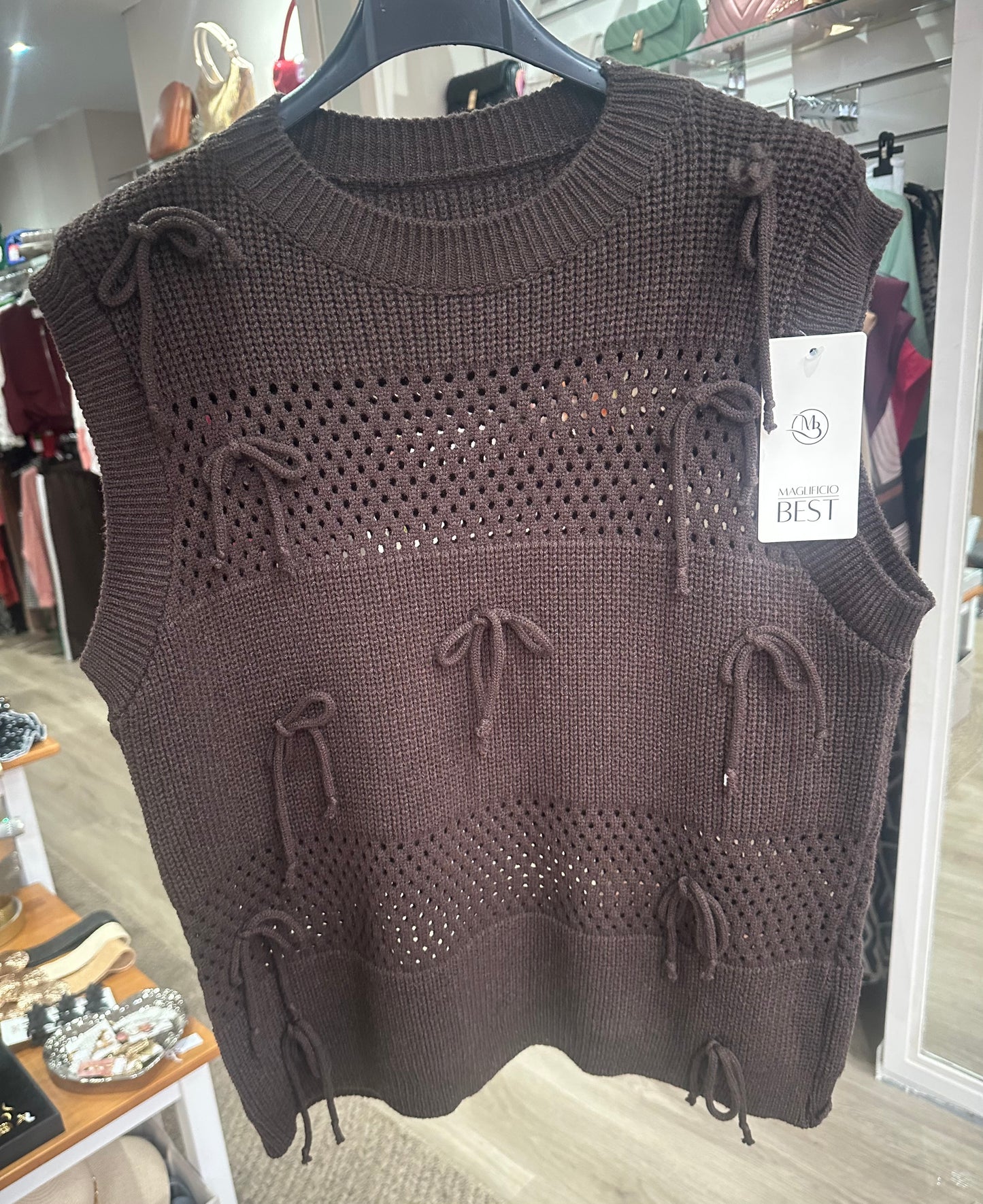 Brown knitted sweater vest with bow detail