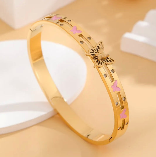 Gold bangle with pink butterfly detail