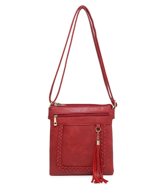 Red crossbody bag with tassel pendant detail