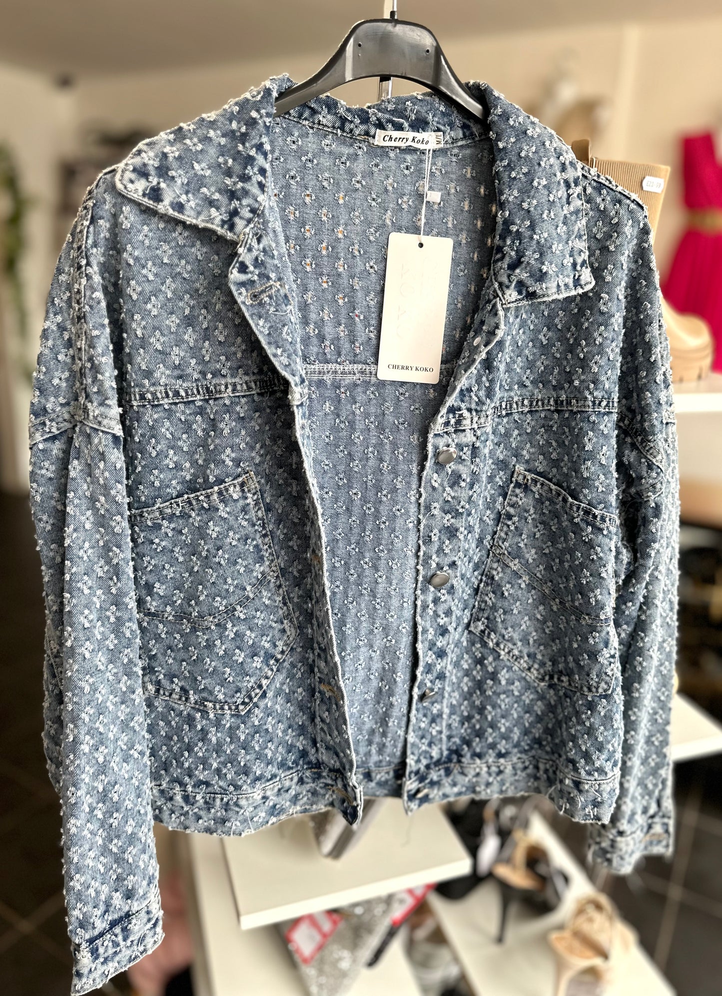 Blue distressed denim jacket