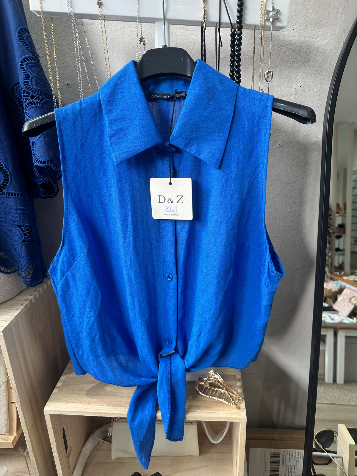Royal blue sleeveless tie front shirt