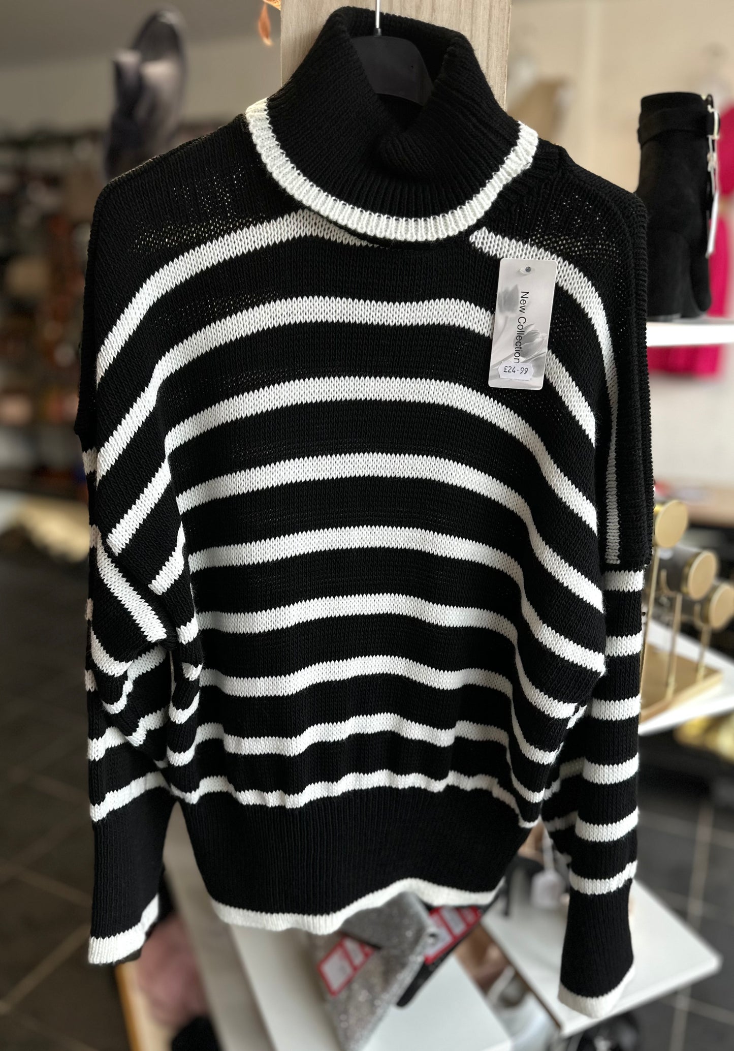 Black and white striped turtle neck jumper