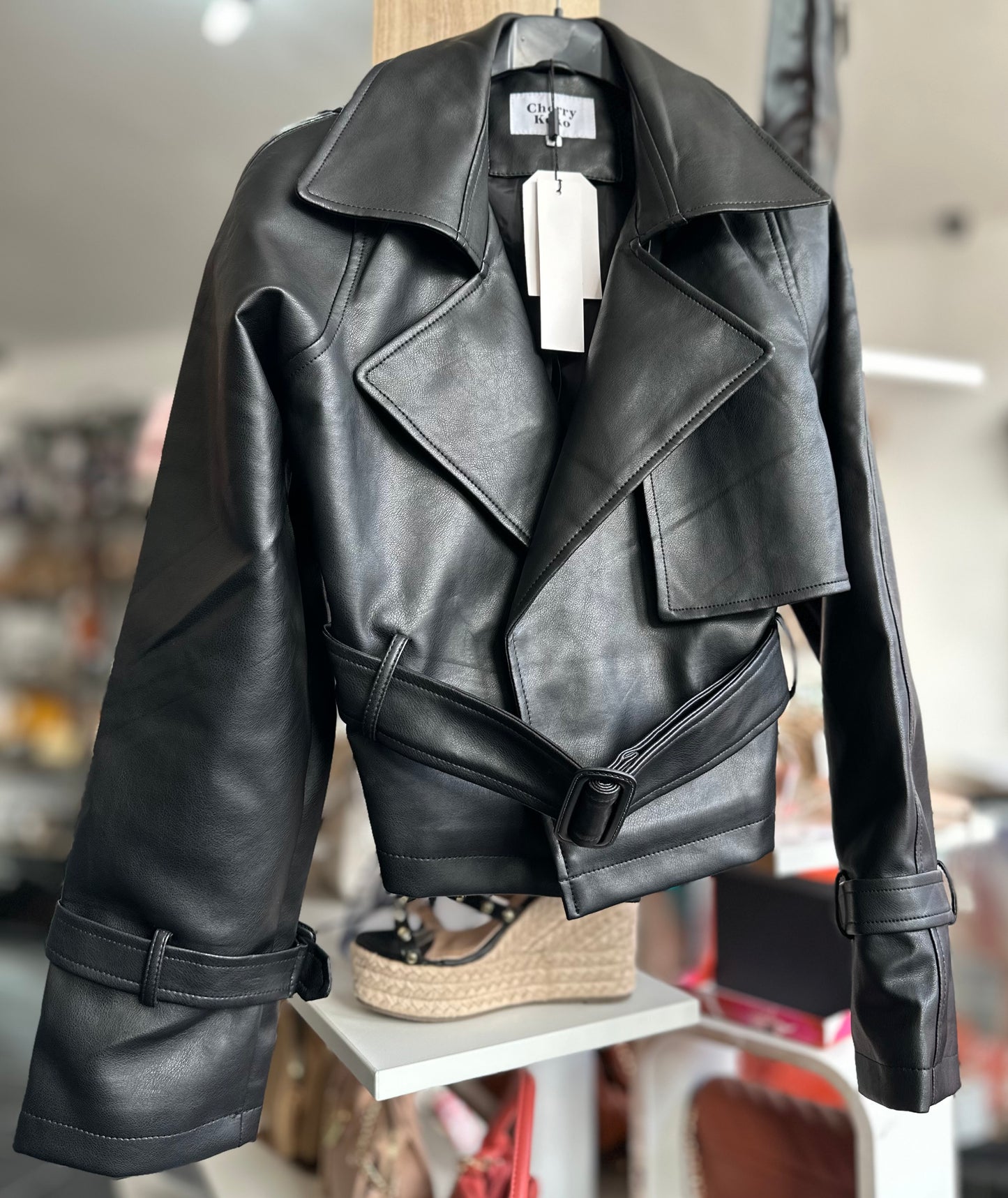 Black faux leather belted jacket