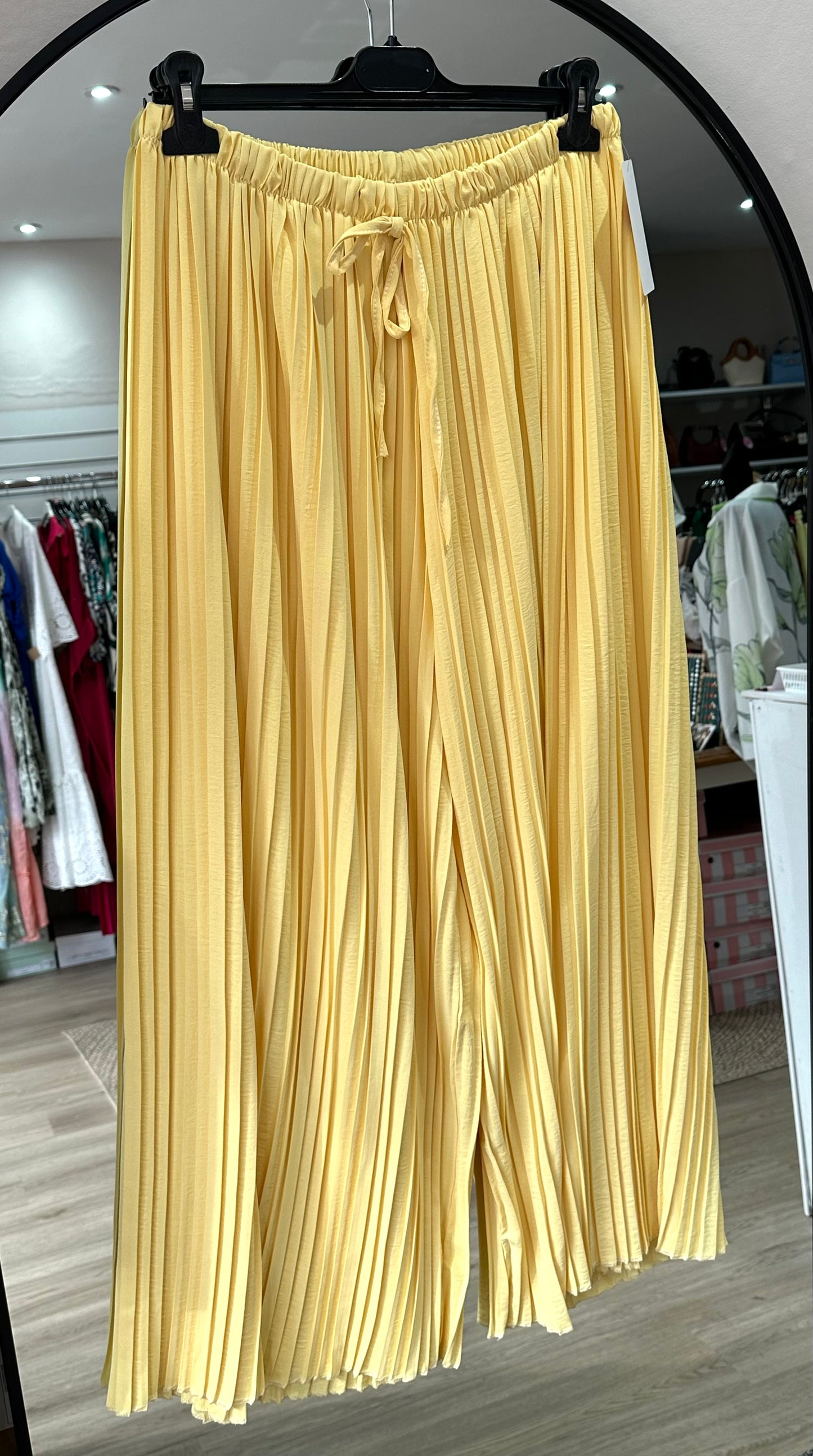 Yellow pleated wide leg trousers