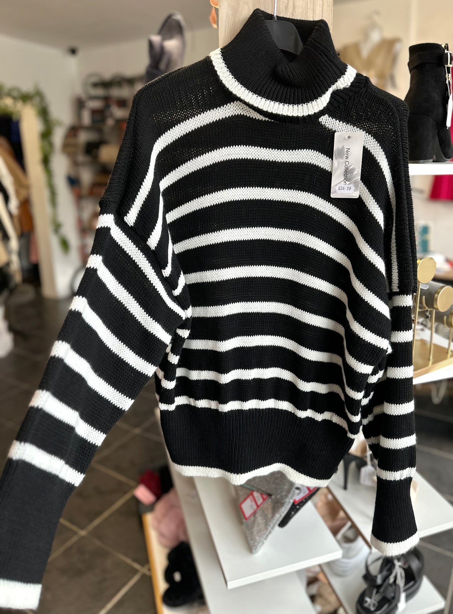 Black and white striped turtle neck jumper