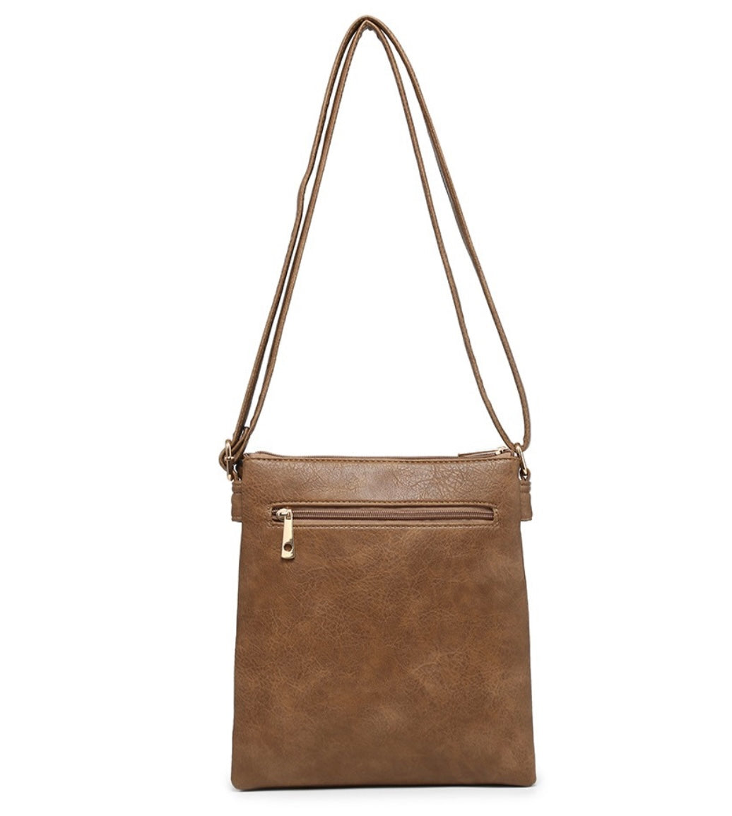 Red crossbody bag with tassel pendant detail
