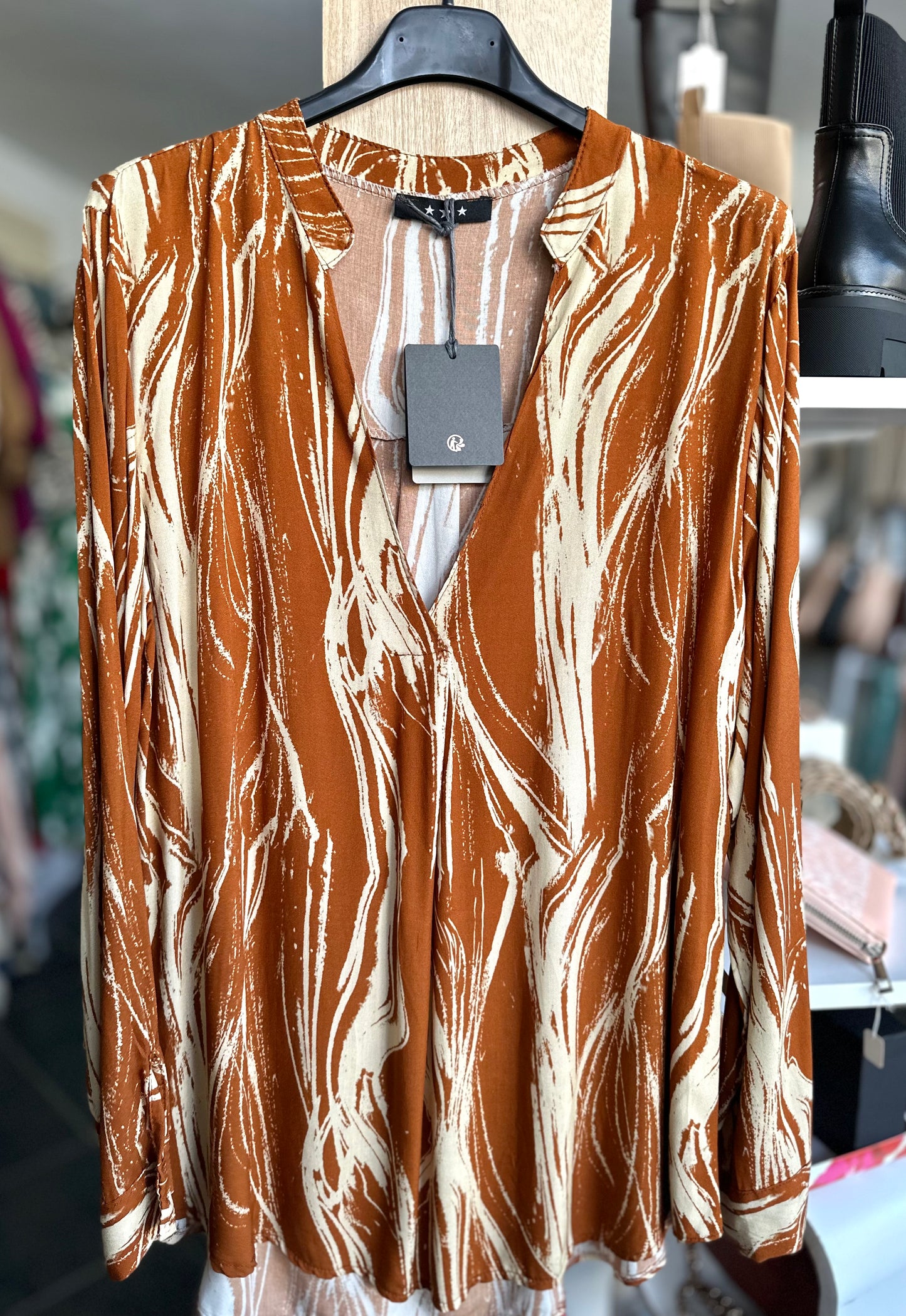 Cinnamon abstract print long sleeve blouse