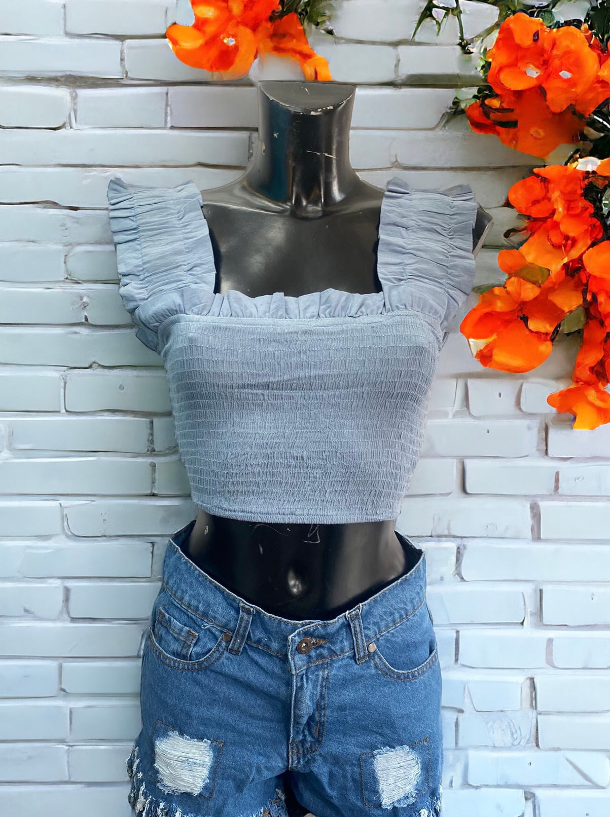 Denim blue ruffle strap shirred top