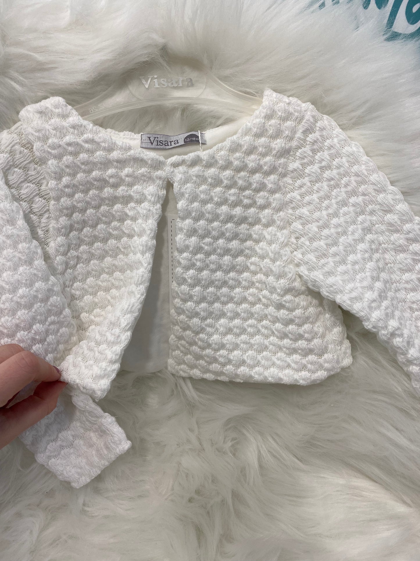 White knitted bolero