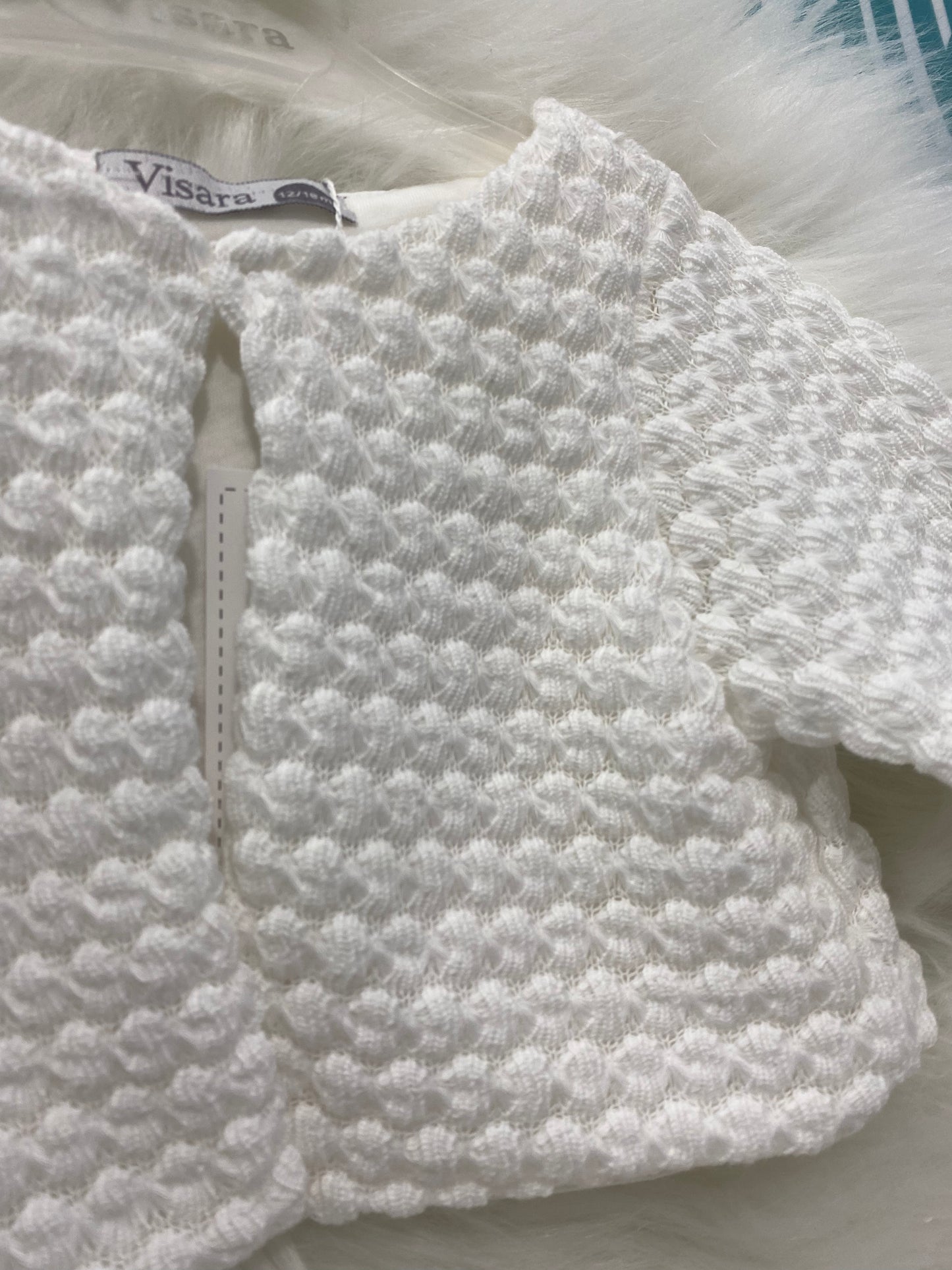 White knitted bolero