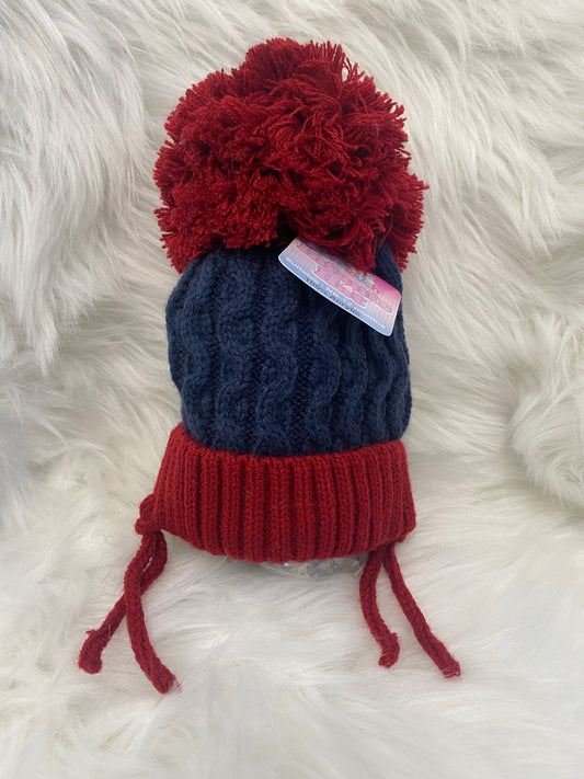 Red and blue pom pom knitted hat