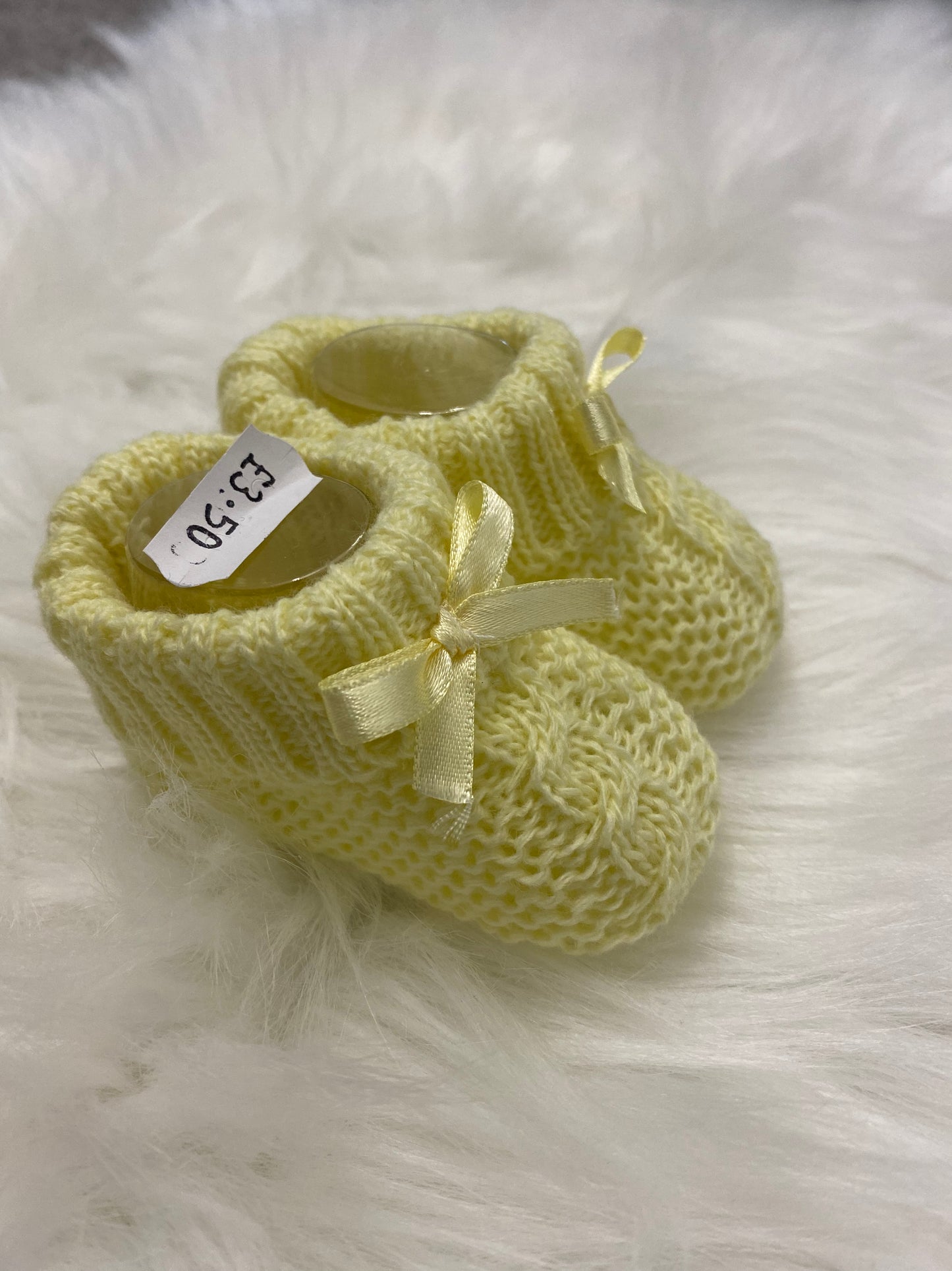 Yellow knitted bow detail booties