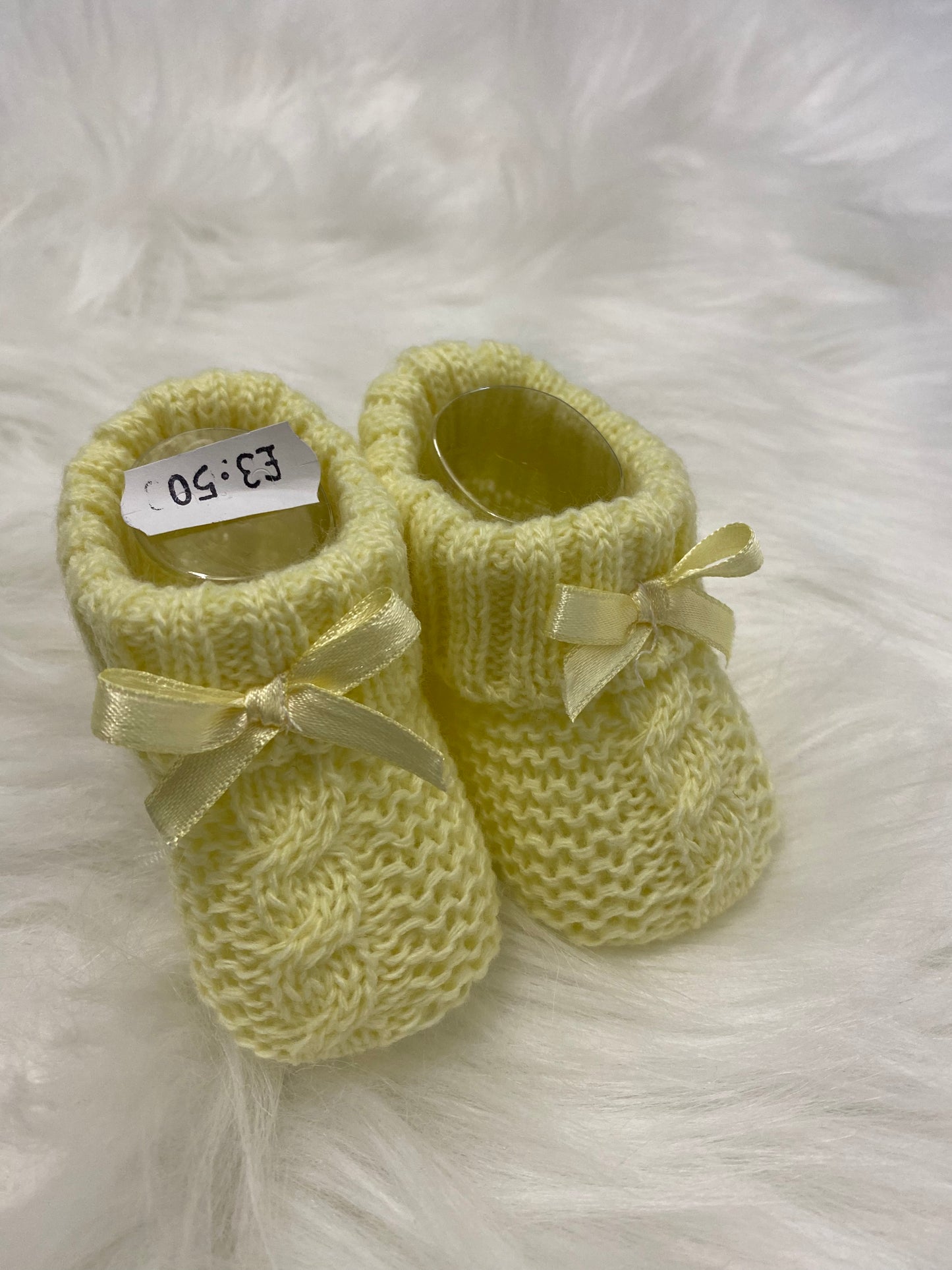 Yellow knitted bow detail booties